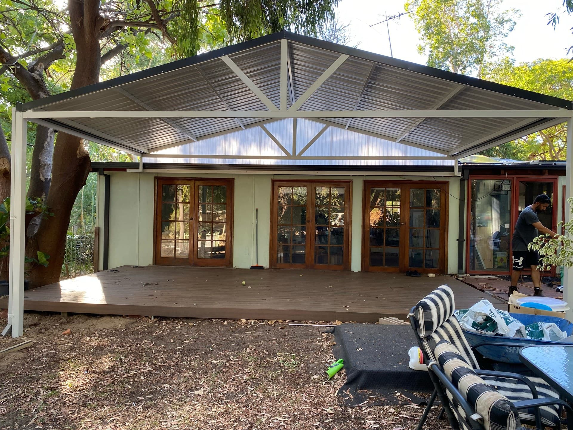 Large gable roof patio installation covering rear deck in a Perth home